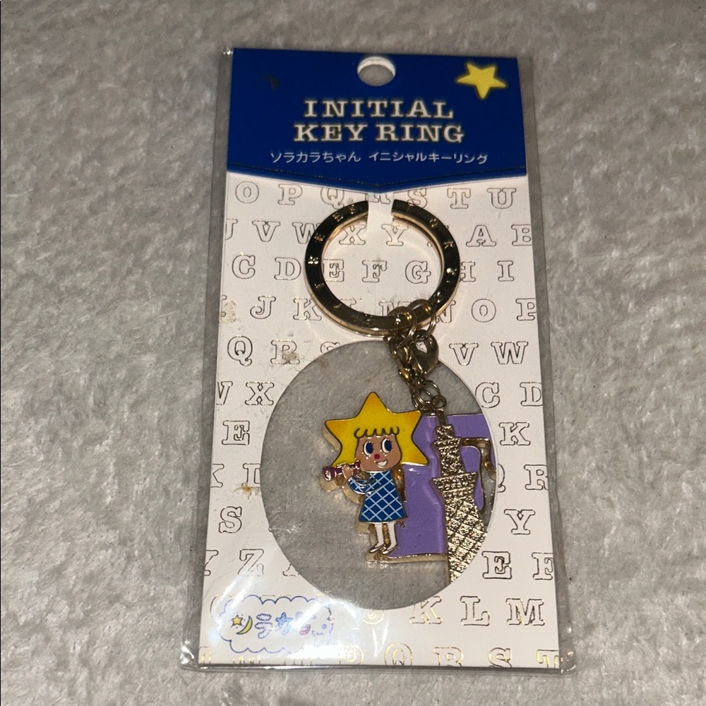 Star Character Key Ring with Purple and Gold Accents